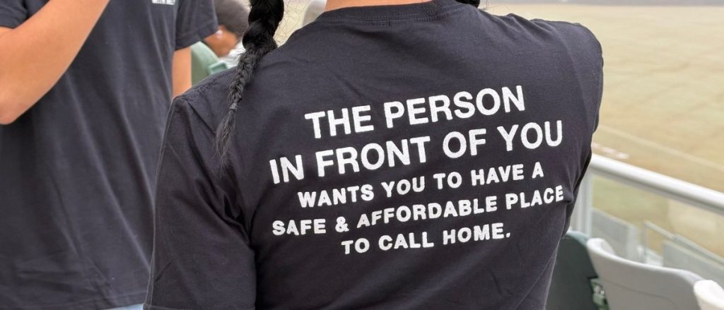 An Orange County resident wearing "The Person in Front of You" campaign t-shirt at the community aerial photo event.